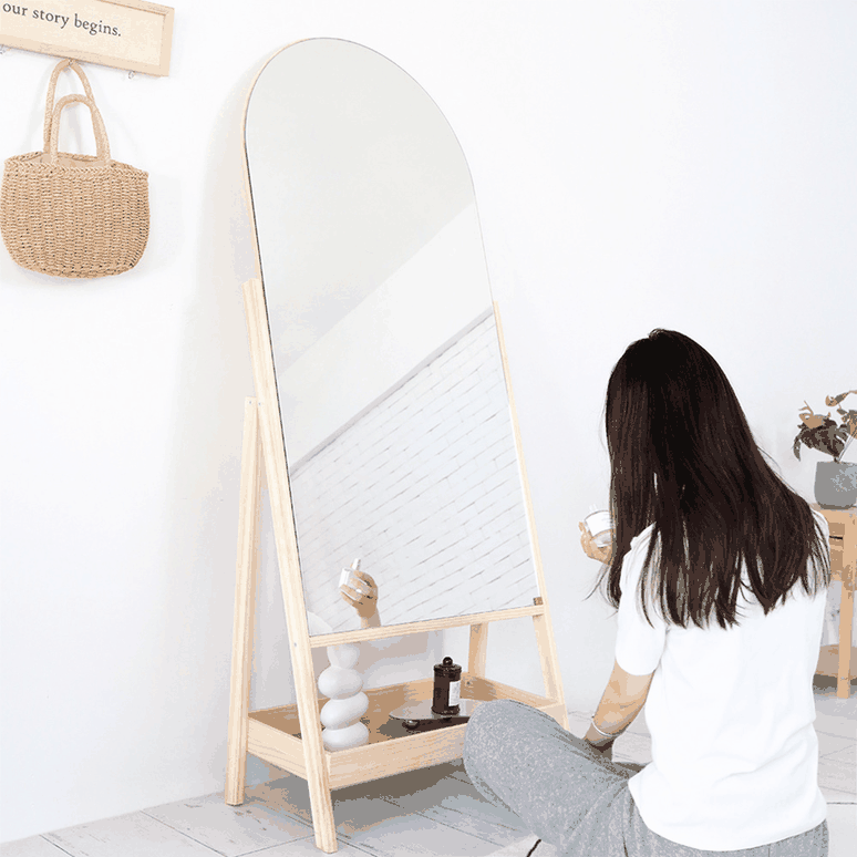 Rear view of an arched wooden easel floor mirror support